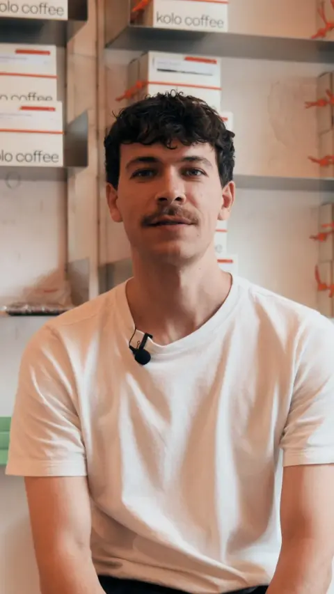 SumUp ad: Meet Vlad, the owner of @kolo.coffeeshop. This isn't your typical coffee shop…