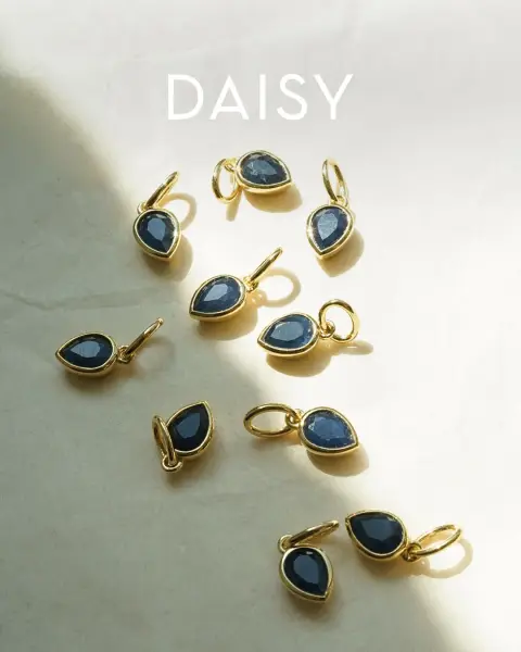 Daisy London ad: Meet the sapphire birthstone charm.
