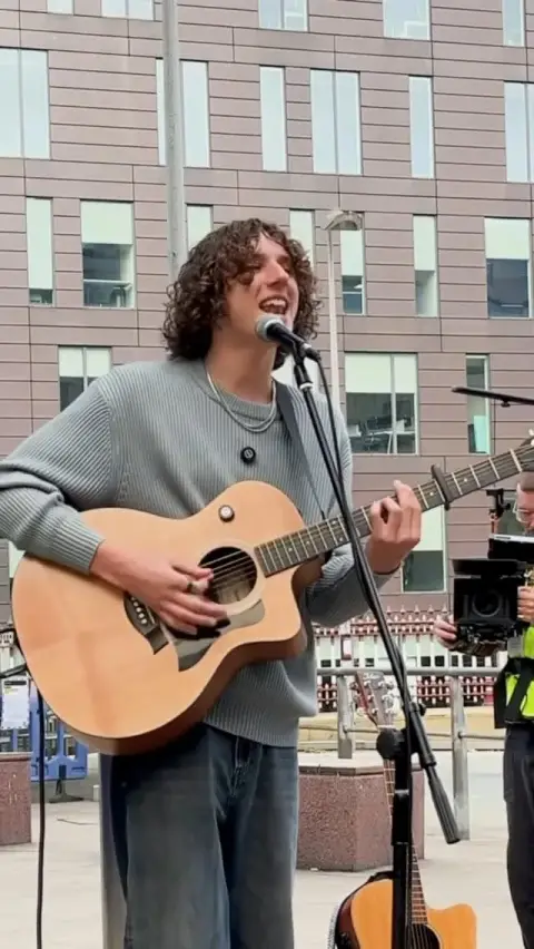 Trainline ad: Went back to my roots busking on the streets of Manchester to let you know…